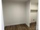 Neutral room featuring hard surface floors and an adjacent laundry closet at 238 Fairchase Cir # 54, Stony Point, NC 28678