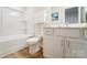 Bright bathroom featuring a tub-shower combo, toilet, and single sink vanity at 2513 Crimson Way, Monroe, NC 28112