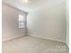 A simple bedroom with a window with blinds for natural light at 2513 Crimson Way, Monroe, NC 28112