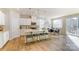 Modern kitchen with stainless steel appliances, a central island with seating, and an adjacent dining area at 2513 Crimson Way, Monroe, NC 28112