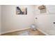 Laundry room with wood floor and overhead shelving at 2513 Crimson Way, Monroe, NC 28112