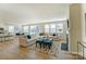 Open concept living room with fireplace, TV, large windows, and hardwood floors at 2513 Crimson Way, Monroe, NC 28112