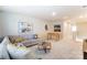 Spacious living room is furnished with a comfortable couch, a foosball table and stylish decorations at 2513 Crimson Way, Monroe, NC 28112
