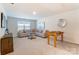 Spacious living room is furnished with a comfortable couch, a foosball table and stylish decorations at 2513 Crimson Way, Monroe, NC 28112