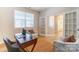Bright home office with a desk, chair, and French doors leading to a well-appointed bathroom at 2513 Crimson Way, Monroe, NC 28112
