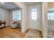 A bright, open office space adjacent to the front door, showcasing the room's versatile layout at 2513 Crimson Way, Monroe, NC 28112