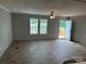 Spacious living room featuring wood-look flooring, a ceiling fan and an abundance of natural light from two windows at 252 Fairchase Cir # 56, Stony Point, NC 28678
