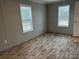 Well-lit bedroom with wood-look flooring and neutral walls at 252 Fairchase Cir # 56, Stony Point, NC 28678