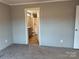 Neutral bedroom with view into bathroom at 252 Fairchase Cir # 56, Stony Point, NC 28678