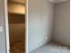 Compact bedroom with a closet space, carpet floors, and neutral-colored walls at 252 Fairchase Cir # 56, Stony Point, NC 28678