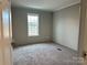 Bedroom featuring neutral carpet, single window, and gray walls at 252 Fairchase Cir # 56, Stony Point, NC 28678
