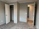 Bedroom showcasing closet, neutral carpet, and view to hallway at 252 Fairchase Cir # 56, Stony Point, NC 28678