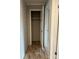 Hallway featuring closet, wood-look flooring, and access to other rooms at 252 Fairchase Cir # 56, Stony Point, NC 28678
