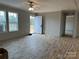 Spacious living room with hardwood floors and a view of the front porch at 252 Fairchase Cir # 56, Stony Point, NC 28678