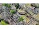 Aerial view of the house showing roof, driveway, mature trees and partially fenced backyard at 2537 Wood Star Ct, Matthews, NC 28105