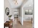 Foyer leading to modern kitchen, featuring stylish décor and warm lighting at 2537 Wood Star Ct, Matthews, NC 28105