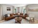 Cozy living room with comfortable seating, natural light, and hardwood floors at 2537 Wood Star Ct, Matthews, NC 28105