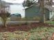 View of backyard with a shed, a lawn, and a lake in the background at 254 N Shoreline N Dr # 38, New London, NC 28127