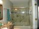 Nicely appointed bathroom showcasing tiled tub/shower with glass door and granite vanity at 254 N Shoreline N Dr # 38, New London, NC 28127