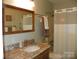 Bathroom featuring a vanity with granite countertops and a shower tub combination at 254 N Shoreline N Dr # 38, New London, NC 28127