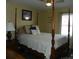 Classic bedroom featuring a wooden four-poster bed and neutral decor at 254 N Shoreline N Dr # 38, New London, NC 28127