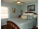 Cozy bedroom features a comfortable bed with blue accents and natural light from the window at 254 N Shoreline N Dr # 38, New London, NC 28127