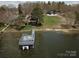The property includes a boat dock with sun loungers and an upper deck for relaxing by the water at 254 N Shoreline N Dr # 38, New London, NC 28127