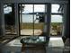 Large windows offer stunning lake views and open up to an outdoor patio at 254 N Shoreline N Dr # 38, New London, NC 28127