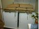 Bright laundry area with white washer and dryer and decorative cushions, offering convenience and style at 254 N Shoreline N Dr # 38, New London, NC 28127