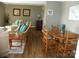 Cozy living room featuring wicker furniture, wood floors, and nautical decor at 254 N Shoreline N Dr # 38, New London, NC 28127