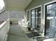 Spacious porch with white railing, outdoor seating, and views of the home's exterior at 254 N Shoreline N Dr # 38, New London, NC 28127
