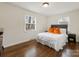 Simple yet elegant bedroom with hardwood floors and natural lighting at 3215 Frederick Pl, Charlotte, NC 28210