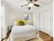 Comfortable bedroom with hardwood floors, a ceiling fan, and closet space at 3215 Frederick Pl, Charlotte, NC 28210