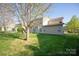 Backyard view showing expansive green space and seating area at 3216 Bridgewick Rd, Waxhaw, NC 28173