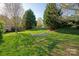 Relaxing backyard scene with a hammock and lush greenery at 3216 Bridgewick Rd, Waxhaw, NC 28173