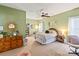 Charming bedroom with a ceiling fan, ample wall decor, and a relaxing atmosphere at 3216 Bridgewick Rd, Waxhaw, NC 28173