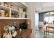 Coffee bar area with granite counters and open shelving, perfect for coffee enthusiasts at 3216 Bridgewick Rd, Waxhaw, NC 28173