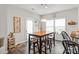 Bright dining area with wood table, modern lighting, and natural light at 3216 Bridgewick Rd, Waxhaw, NC 28173