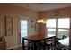 Bright dining area features modern lighting and backyard access at 3216 Bridgewick Rd, Waxhaw, NC 28173