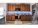 Well-equipped kitchen boasting ample wood cabinetry, stainless steel appliances, and modern backsplash at 3216 Bridgewick Rd, Waxhaw, NC 28173