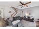 Comfortable living room features with ceiling fan, staircase, and stylish decor at 3216 Bridgewick Rd, Waxhaw, NC 28173