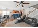 Open living area with a ceiling fan, staircase, and a view into the kitchen at 3216 Bridgewick Rd, Waxhaw, NC 28173