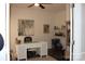 Functional home office with a white desk, shelves, and natural light, ideal for productivity at 3216 Bridgewick Rd, Waxhaw, NC 28173