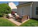 Cozy patio area with comfortable seating and a small table at 3216 Bridgewick Rd, Waxhaw, NC 28173