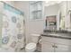 Bathroom featuring a granite vanity, patterned shower curtain, and toilet at 4023 Gozzi Dr, Iron Station, NC 28080