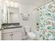 Bathroom featuring a shower/tub combo and vanity with granite counter and storage at 4023 Gozzi Dr, Iron Station, NC 28080