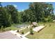 View of tennis courts, picnic area, and landscaped common grounds, great for outdoor recreation and relaxation at 4023 Gozzi Dr, Iron Station, NC 28080