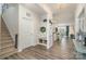 Entryway boasting hardwood floors, a convenient drop zone, and an open view to the kitchen and dining area at 4023 Gozzi Dr, Iron Station, NC 28080