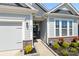 Inviting front entrance featuring well-maintained landscaping, a welcoming front door, and a clean walkway at 4023 Gozzi Dr, Iron Station, NC 28080