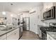 Well-equipped kitchen features granite countertops, stainless steel appliances, and ample storage at 4023 Gozzi Dr, Iron Station, NC 28080